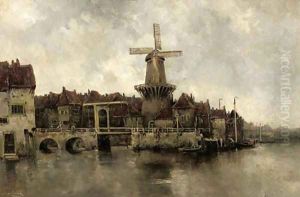 A windmill by a drawbridge in a town