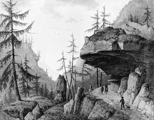 A rocky Landscape with Travellers and a Huntsman with his Dog on a Road by Mattheus Derk Knip