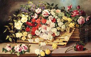 Carnations, Roses And Lilac In A Wicker Basket On A Table