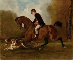 A Young Boy On Horseback With Hounds In A Forest by Alfred De Dreux