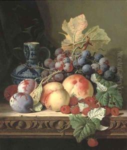 Plums, peaches, raspberries, grapes and a stoneware jug on a carved table