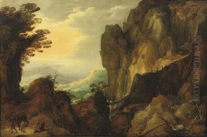 A Rocky Landscape With Travellers On A Path And Crossing A Bridge By A Waterfall by Joos De Momper