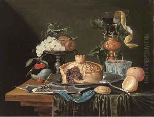 A pie on a pewter plate, grapes and cherries on a pewter tazza, a partly-peeled lemon in a glass roemer and a Dutch delft blue