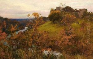 A View Across A River Valley To A Castle Ruin.