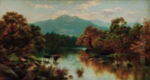Cattle watering in a mountainous landscape