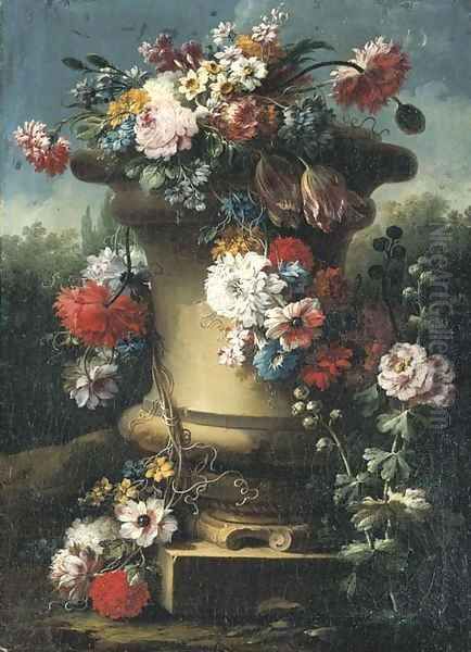 Narcissi, tulips, chrysanthemums, roses and other flowers in a stone urn with hollyhocks, a wooded landscape beyond - view 1
