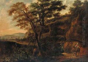 A wooded landscape with a traveller on a donkey