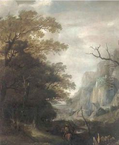 A mountainous landscape with a horseman on a wooded track by Jan Looten