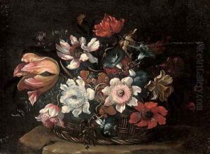 A tulip, morning glory, roses and other flowers in a wicker basket on a stone ledge