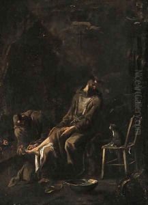 A Capuchin friar tending a companion's foot by a fire