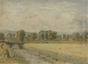 A Field Of Wheat With A Village Beyond