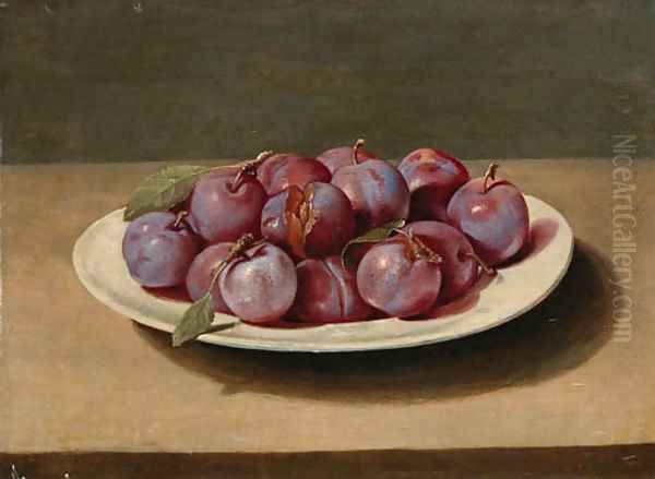 Plums on a white dish on a table - view 1
