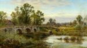A Figure Crossing A Bridge Over A River With Cattle Watering At The Bank