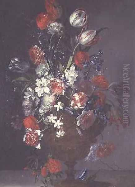 Tulips roses and other flowers in a vase on a ledge - view 1