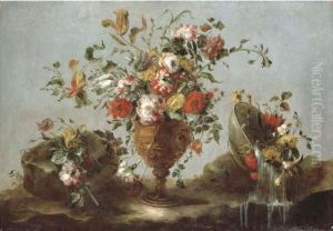 Roses, Peonies And Tulips In A
Gold Sculpted Urn With Flowers In A Pewter Bowl By A Rock Pool by Francesco Guardi