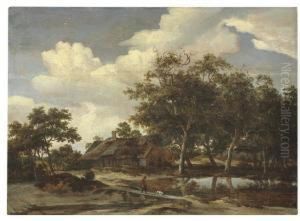 A Wooded Landscape With A Figure Crossing A Bridge Over A Stream