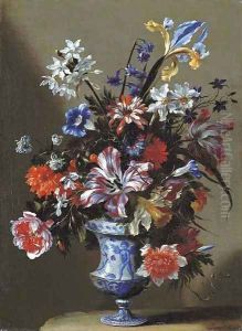 Lilies, peonies, narcissi, morning glory and other flowers in a blue and white vase on a stone ledge by dei Fiori (Nuzzi) Mario