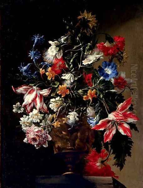 Tulips, roses, daffodils, a carnation, a poppy, anemone, jasmine, morning glory and other flowers in a sculpted urn, on a stone ledge - view 1