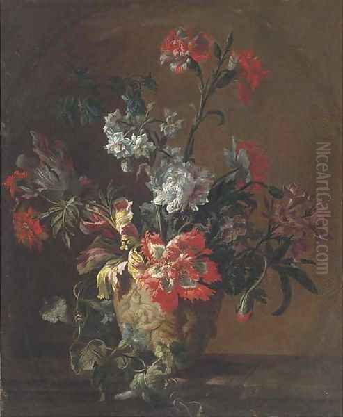 Carnations, parrot tulips, narcissi and other flowers in a sculpted urn on a ledge - view 1