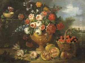 Mixed flowers in a vase with cherries in a basket