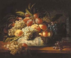 Plums, grapes, and peaches in a blue and white bowl on a table