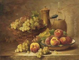 Grapes in a basket with a dish of peaches