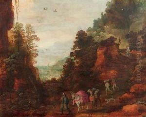 A rocky wooded landscape with travellers and mules on a track by Josse de Momper