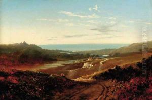 A figure on a track with an estuary beyond