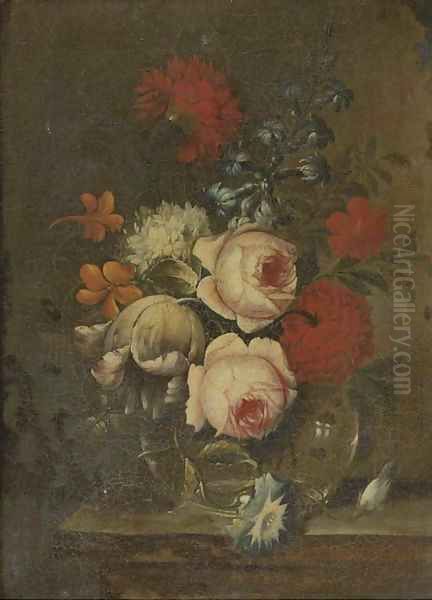 Roses, parrot tulips, narcissi and other flowers in glass vase on a ledge - view 1