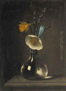 A daffodil, anenomie, crocus and blossom in a glass vase on a ledge A daffodil, anenomie, crocus and blossom in a glass vase on a ledge