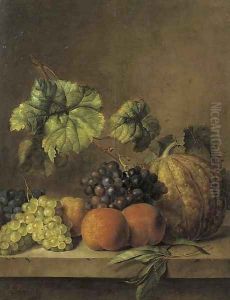 A melon, peaches and grapes on the vine on a ledge