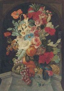 Mixed flowers in an urn on a ledge with grapes and a bird's nest