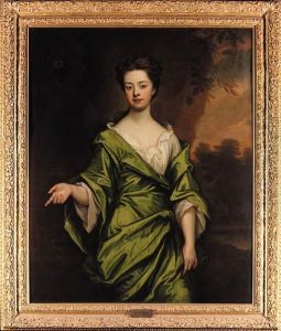 Portrait Of Mrs Harris, 
Three-quarter-length, In A Green Dress,seated In A Wooded Landscape by Sir Godfrey Kneller