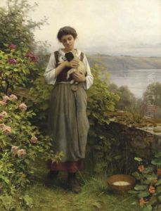 A Young Girl Holding A Puppy