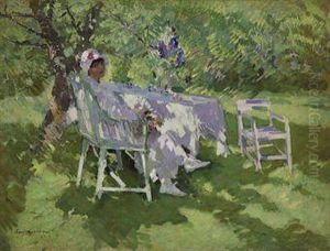 A Lady In White Seated In A Garden by Konstantin Alexeievitch Korovin