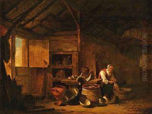 A woman plucking a duck in a barn