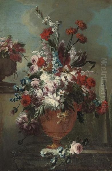 Roses, Carnations, Marigolds,
Narcissi, Chrysanthemums And Otherflowers, In An Urn On A Ledge, An
Obelisk Beyond - view 1