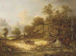 A log cart on a wooded track, with Norwich beyond