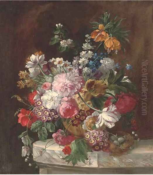 Roses, tulips, chrysanthemums, narcissae and other summers blooms in an urn by a bird's nest on a marble ledge - view 1