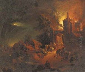 A house on fire at night