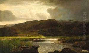 Cattle watering in a sunlit mountainous landscape