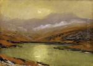 Hazy Mountains With With The Sun Reflecting In The Lake