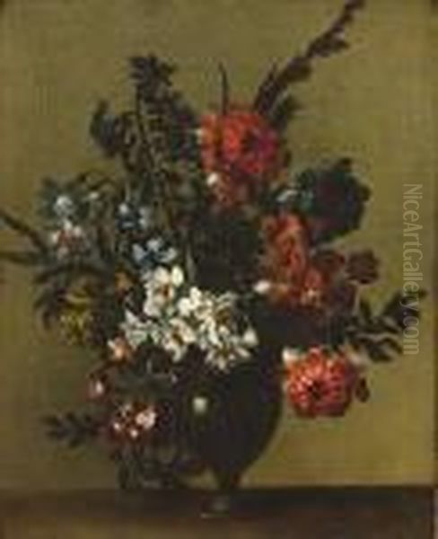Chrysanthemums, Narcissi, Pansies And Other Flowers In A Glass Vase On A Ledge - view 1