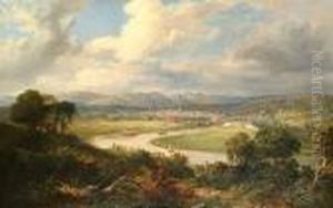 Extensive River Landscape With A View To A Town In The Distance.