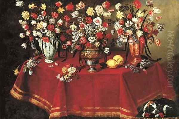 Arrangements of flower bouquets in a majolica vase, a sculpted pewter and bronze urn and a ceramic ewer on a draped octagonal table - view 1
