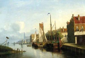 Sailingvessel along a quay, a church towering in the distance