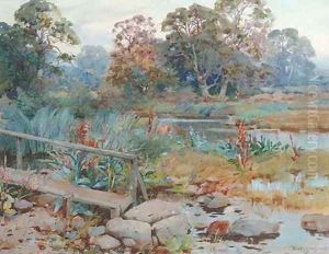 A wooded river landscape by Frank Richards, R.B.A.