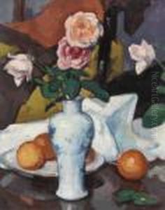 Roses In A Vase With Oranges And A White Tablecloth
