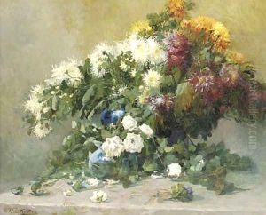 Mixed summer flowers in a blue vase on a table