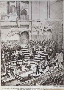 At The Prom Sir Henry Wood conducting his Symphony Orchestra in one of this year's successful series of Promenade Concerts at the Queen's Hall, organised by the British Broadcasting Corporation